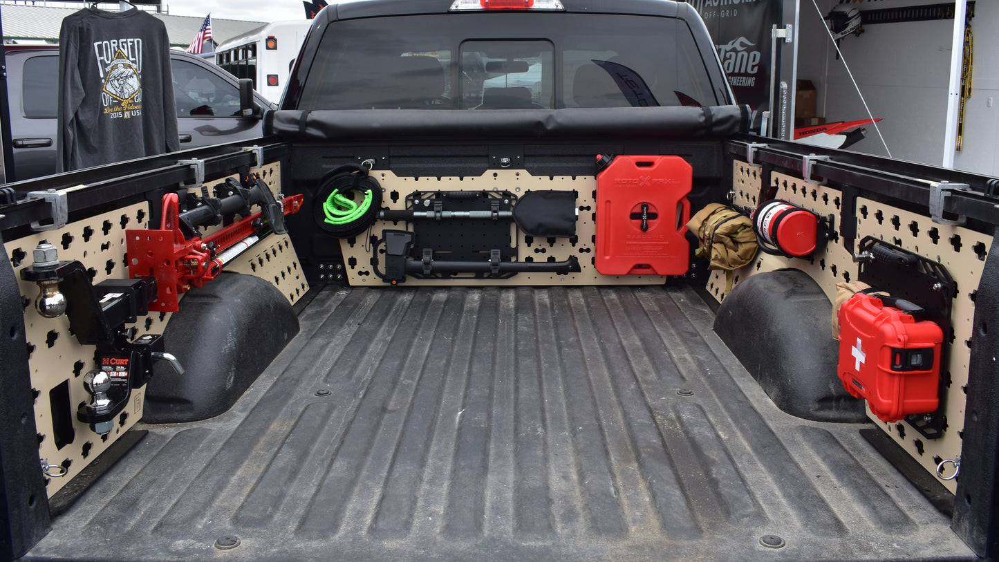 Truck bed with various equipment and tools on a cloudy day.