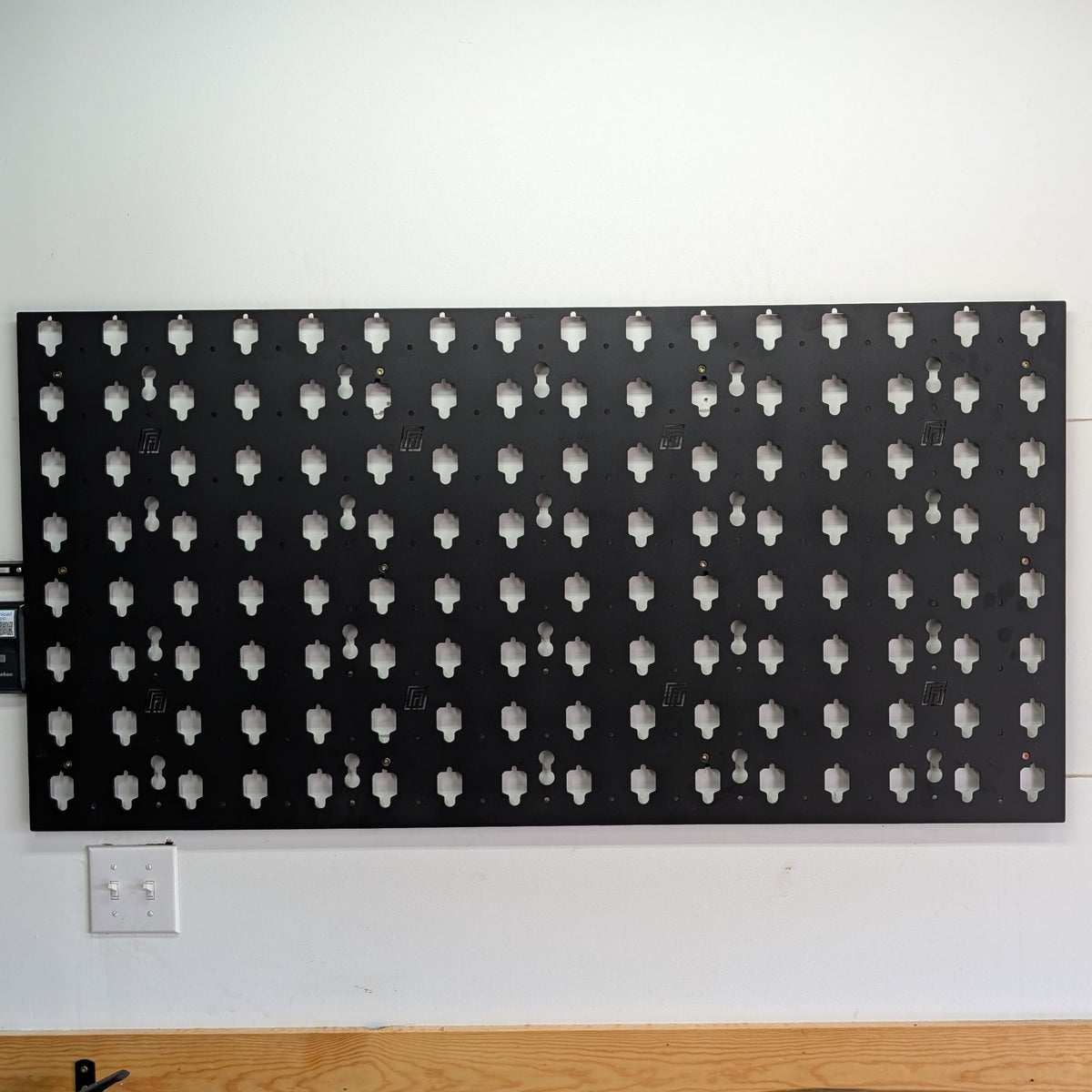 MOBUL Wall Panel 2x4, mounted on garage wall, centered front view.