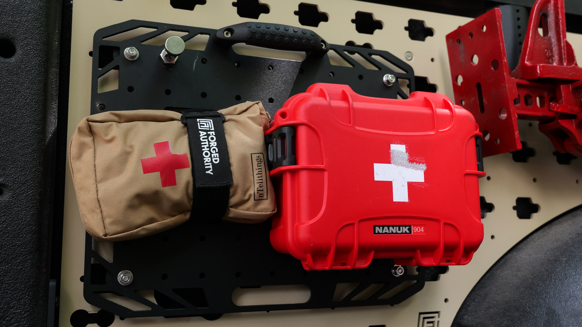 Forged Authority MOBUL F-150 Front Side Panel, used to securely store tools and gear in your truck bed, featuring a Forged Authority Tool Board with first aid kits.