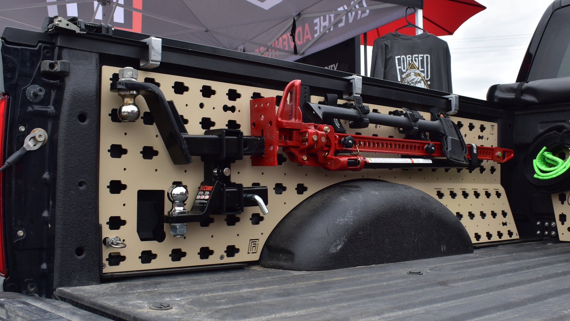 Forged Authority Tan MOBUL F-150 Side Panels with Forged Authority HiLift Jack Mount and Hitch Holder accessories.