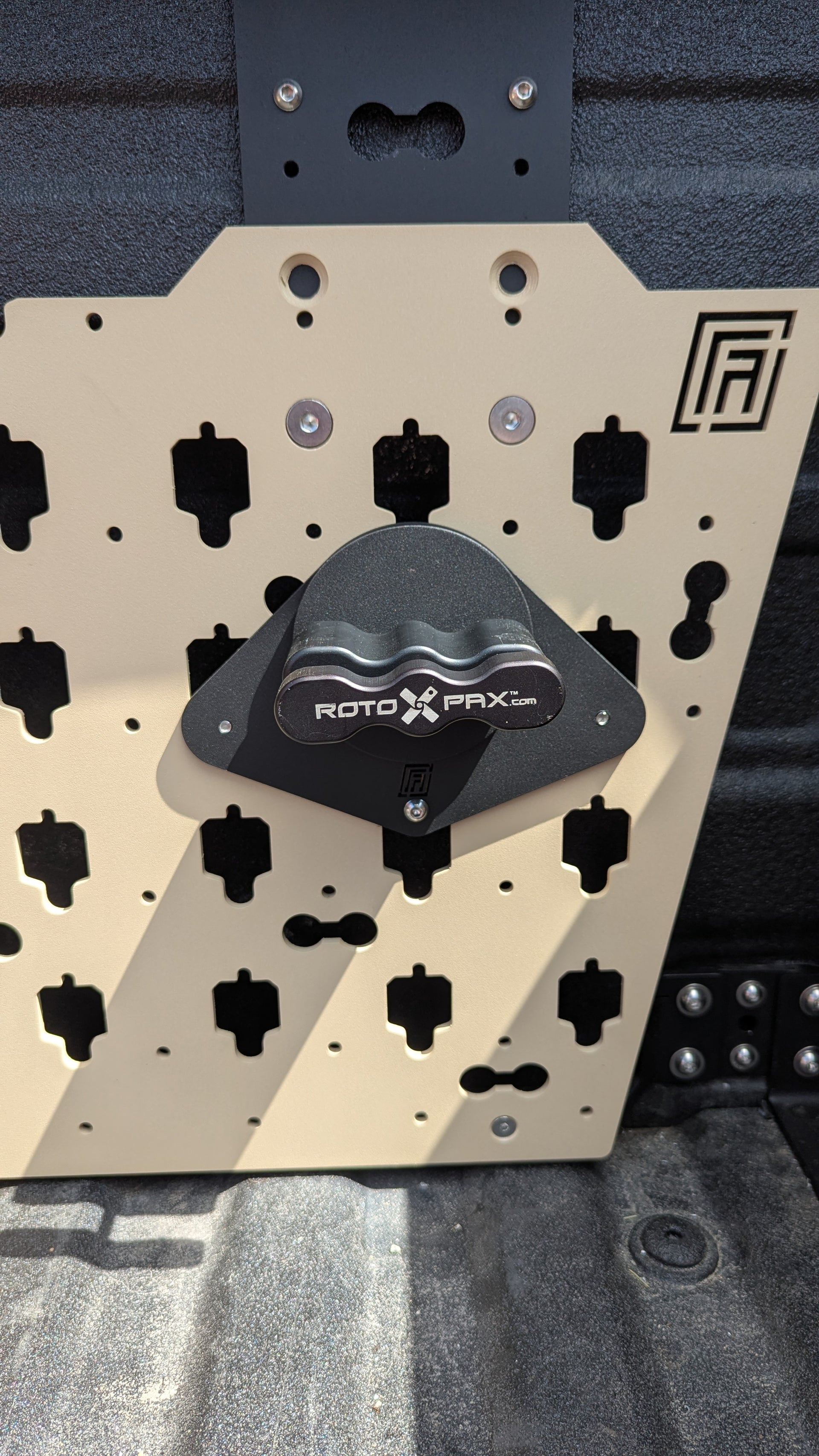 Forged Authority MOBUL F-150 Front Side Panel, used to securely store tools and gear in your truck bed, featuring a Forged Authority RotoPax Adapter for 1 Gallon RotoPax Gasoline Container.