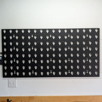 MOBUL Wall Panel 2x4, mounted on garage wall, centered front view.