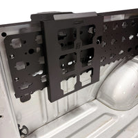 MOBUL Adapter Plate | Compatible with Milwaukee PACKOUT, 3/4 view on a black MOBUL panel in a truck bed.