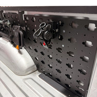 MOBUL Retractable Ratchet Strap Mount, with a second mount on a MOBUL panel in a truck bed.